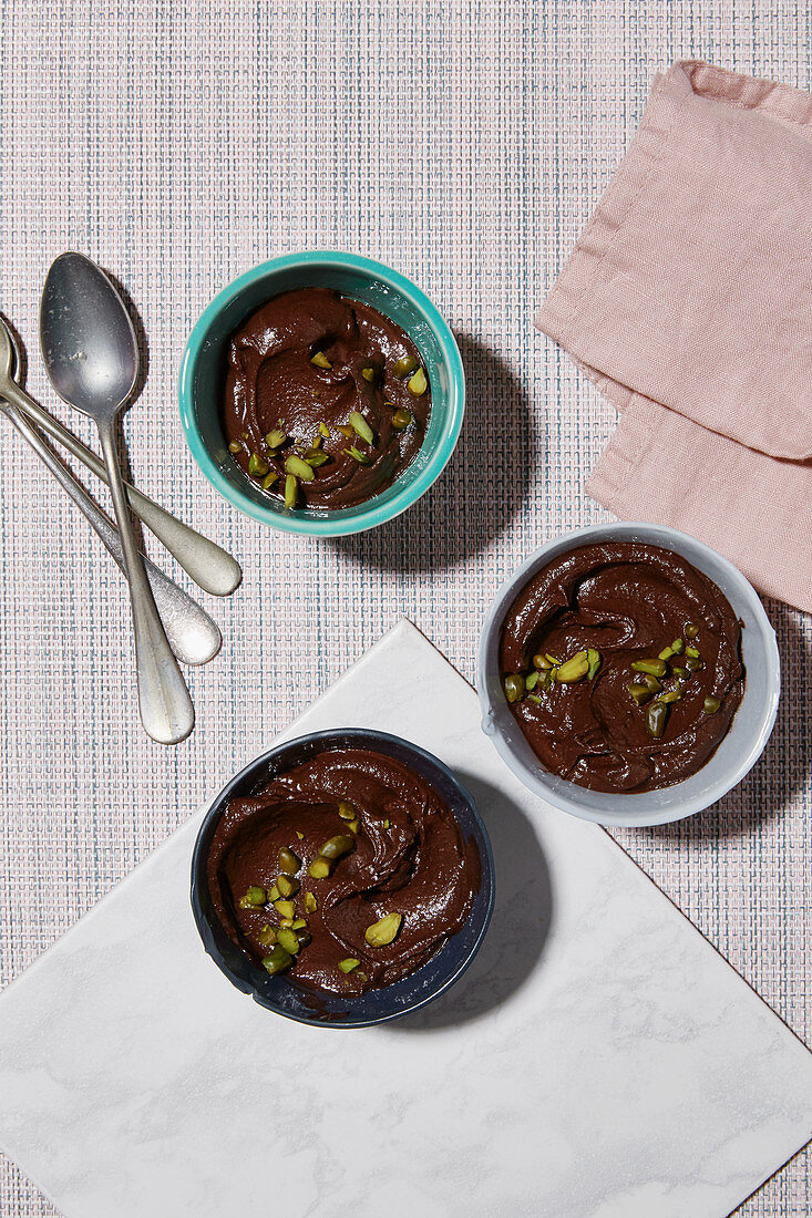 Chocolate-avocado cream with pistachios and chilli flakes