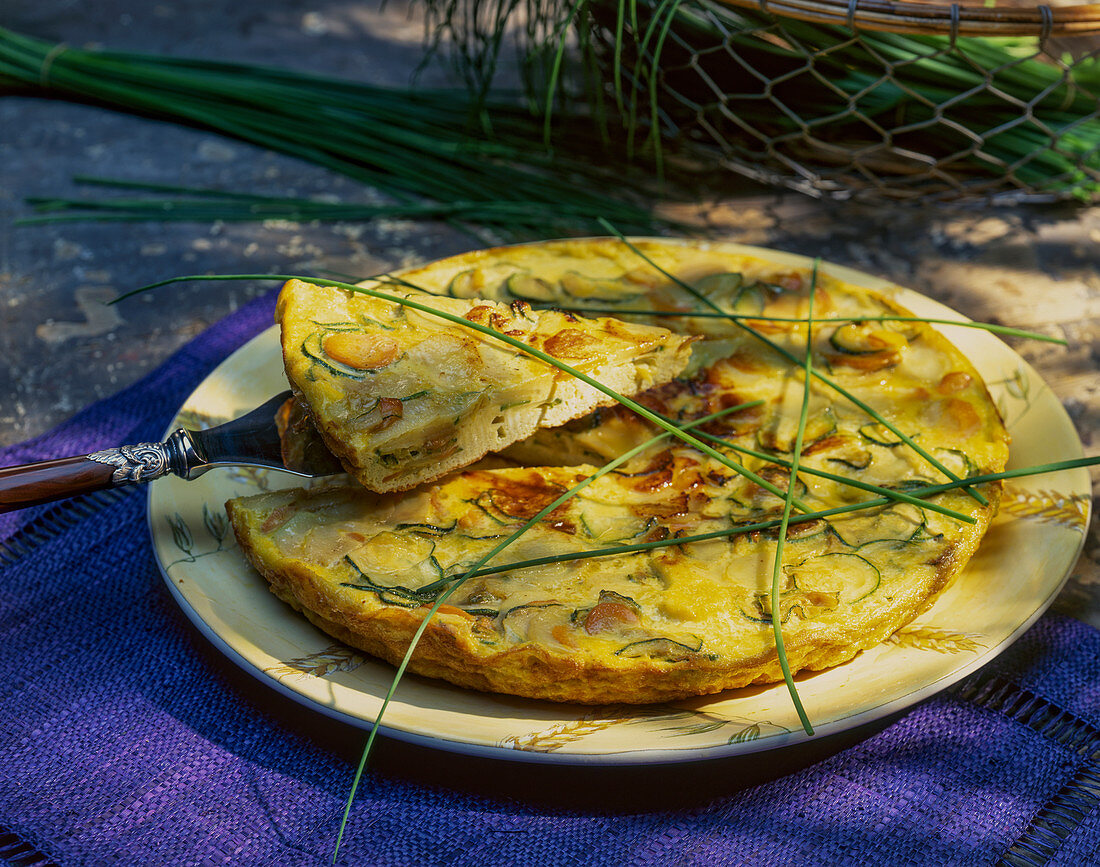 Courgette quiche with cheese and chives