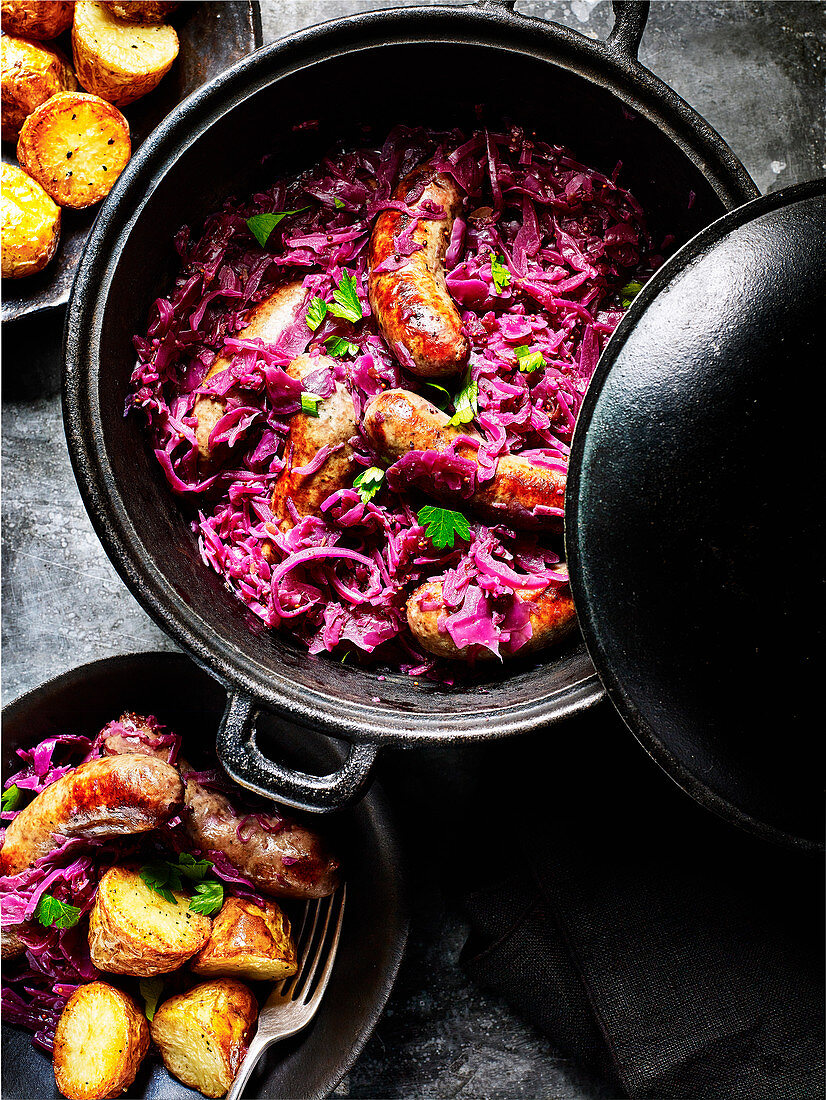 Wild boar bangers with cider-braised red cabbage