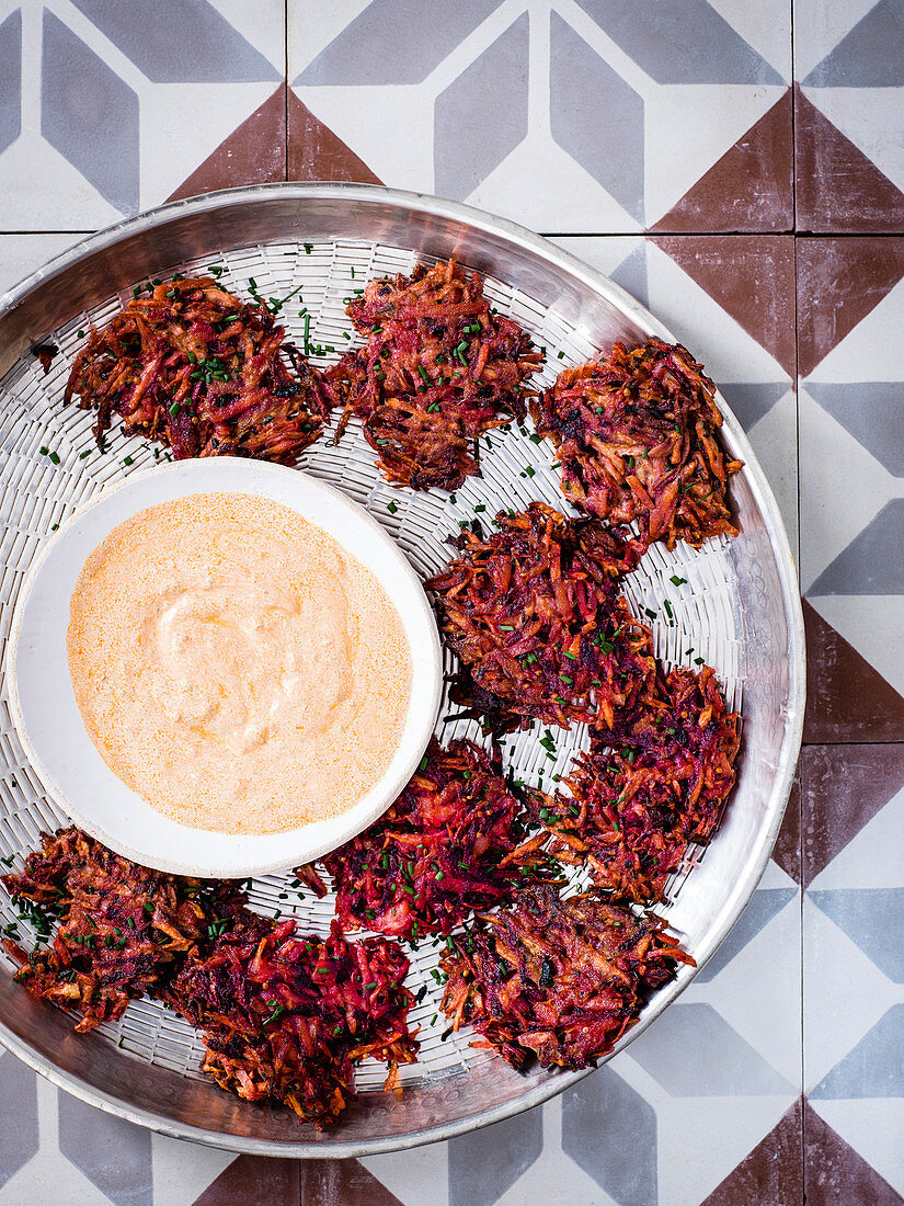 Spiced root vegetable fritters with harissa and lime yogurt