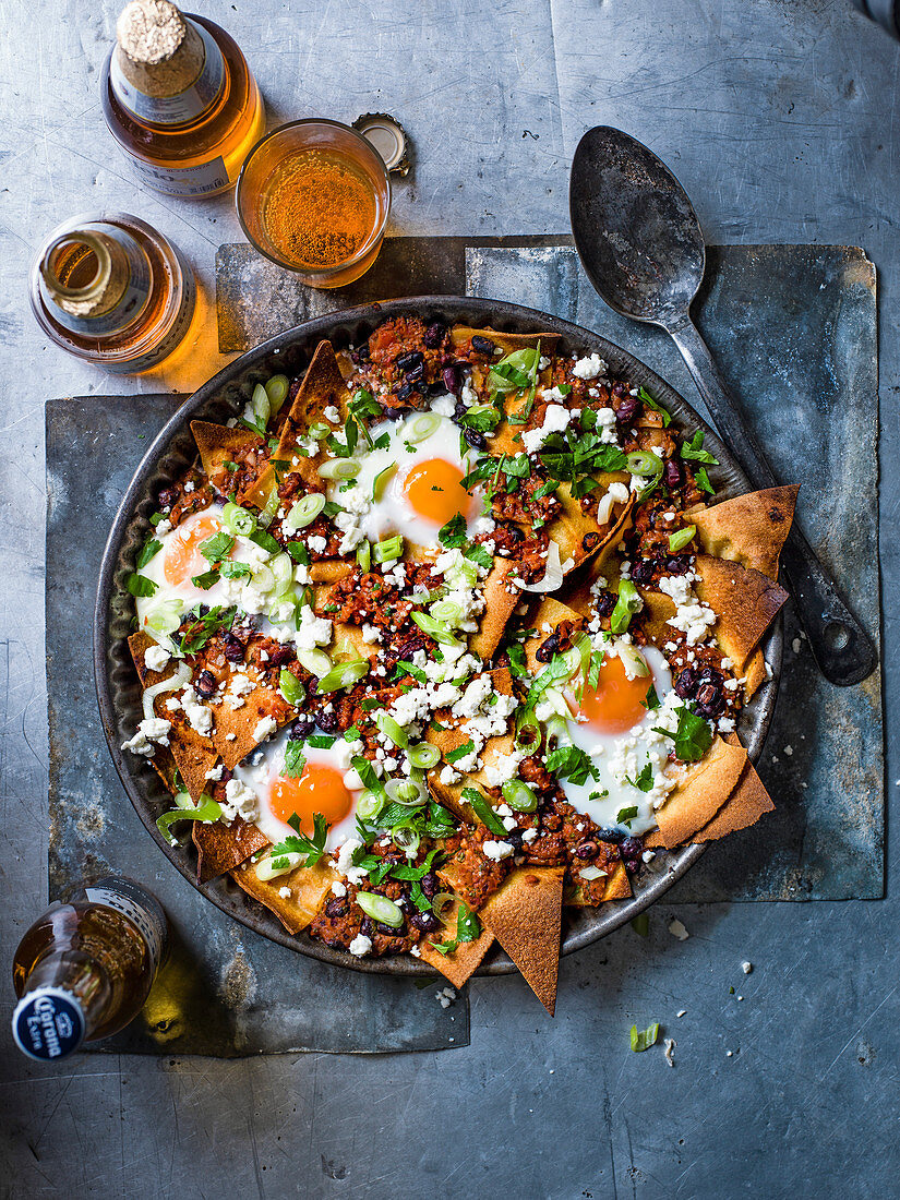 Oven baked chilaquiles with eggs and feat