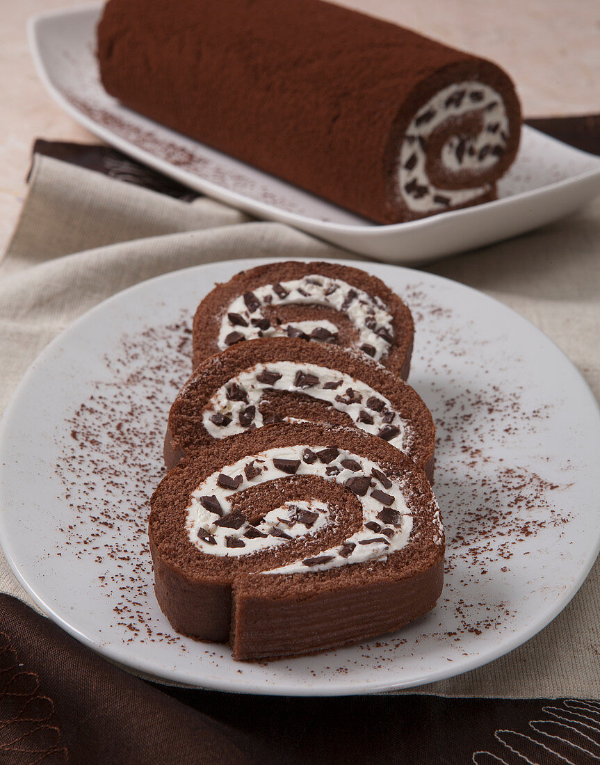 Chocolate Swiss roll with white chocolate cream and dark chocolate