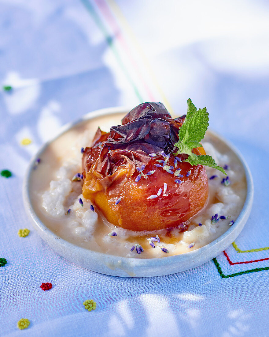 A roasted peach with rice pudding and caramel sauce