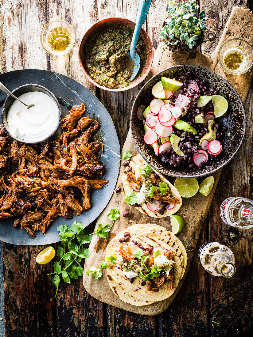 Beer-braised lamb tacos with charred green tomato salsa