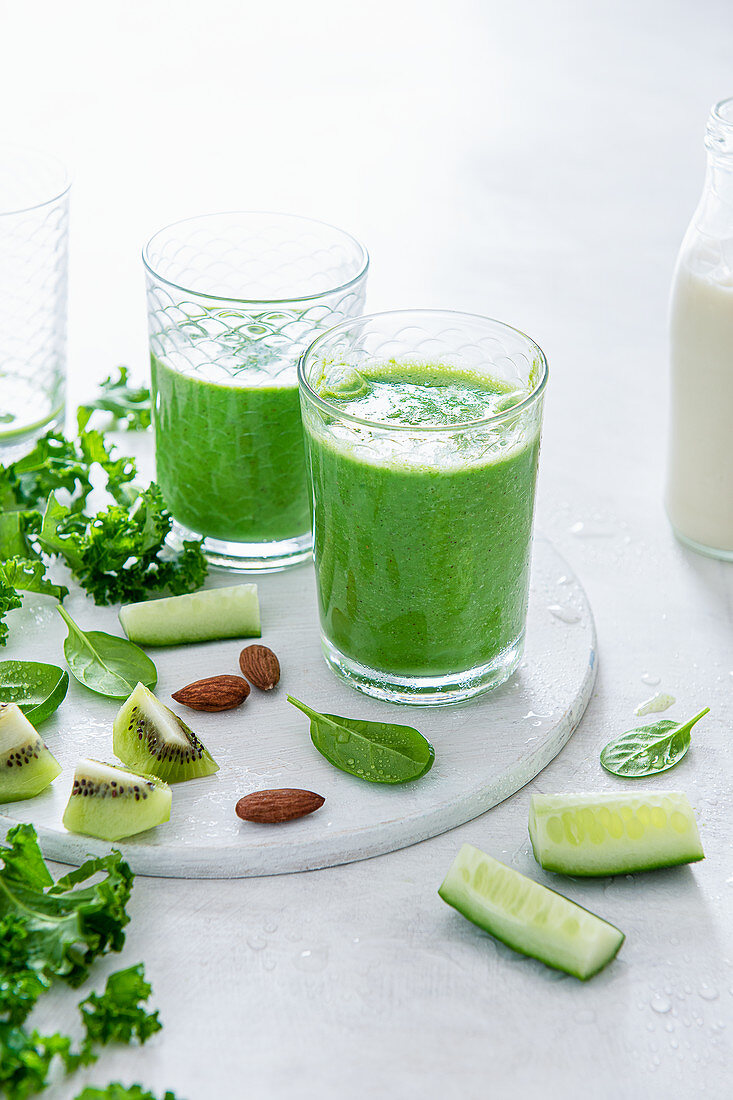 Spinach, kale and cucumber smoothie with kiwi and almond milk