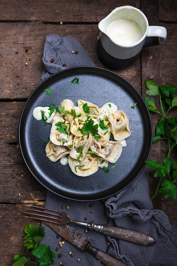 Vegan ravioli with spinach filling on parsnip and cashew sauce