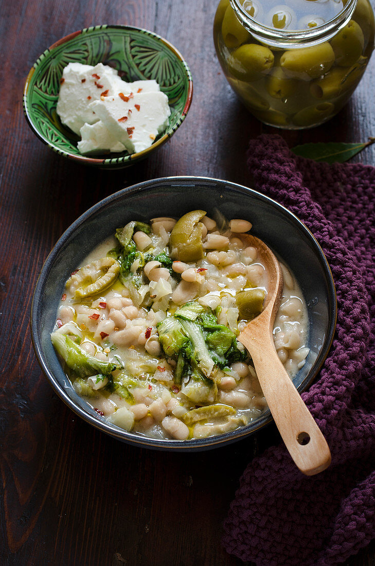 Navy bean and escarole stew with feta and olives