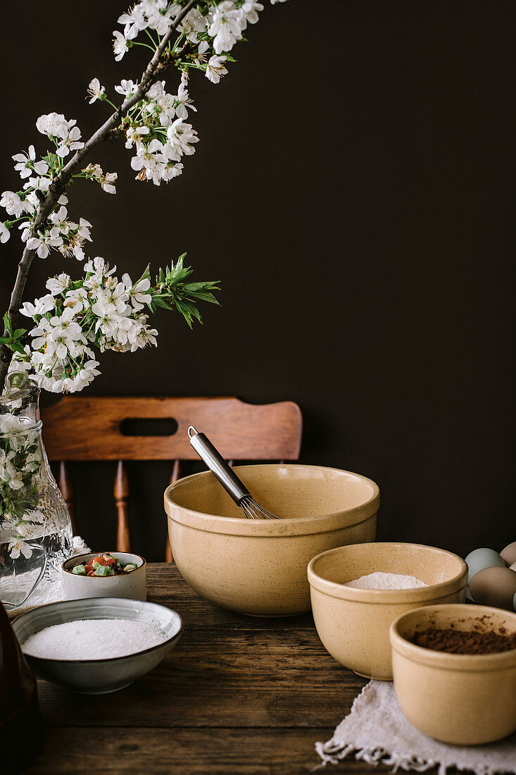 Cooking a bundt cake at home in a rustic kitchen, on a wooden table