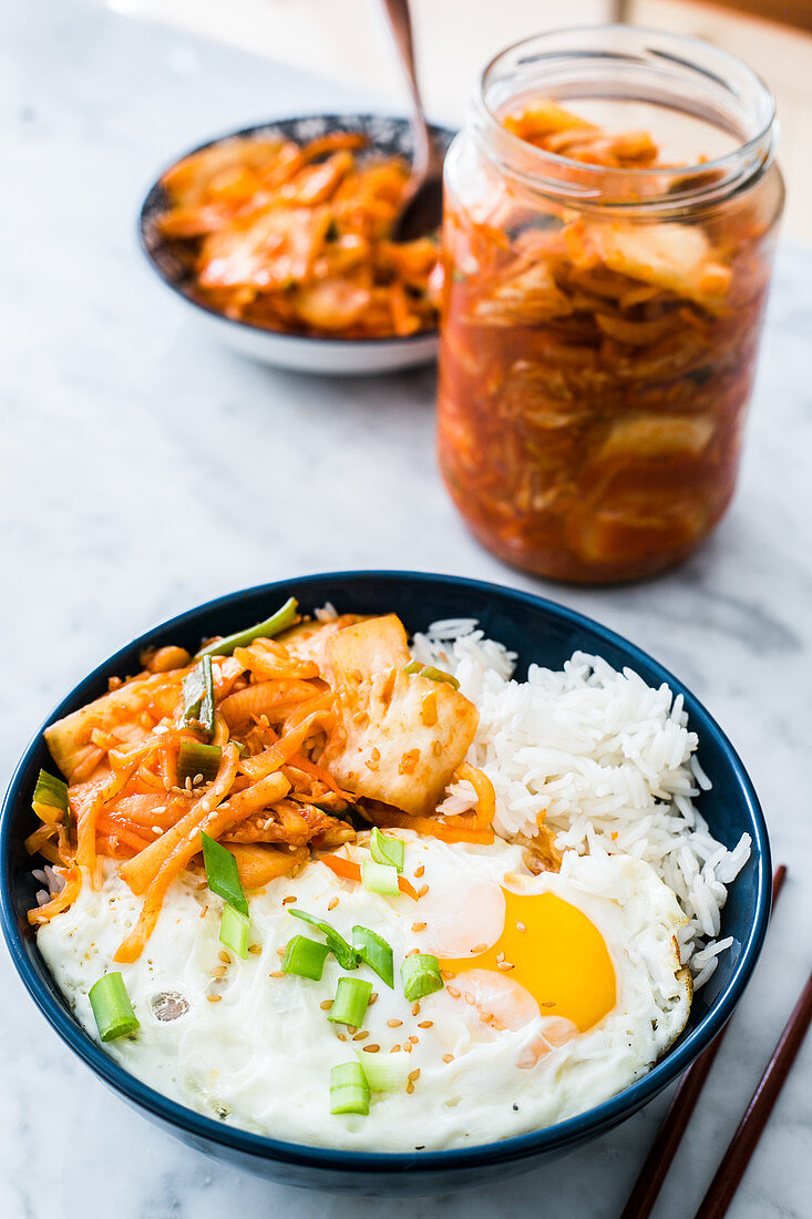 Bowl of fried egg rice and kimchi