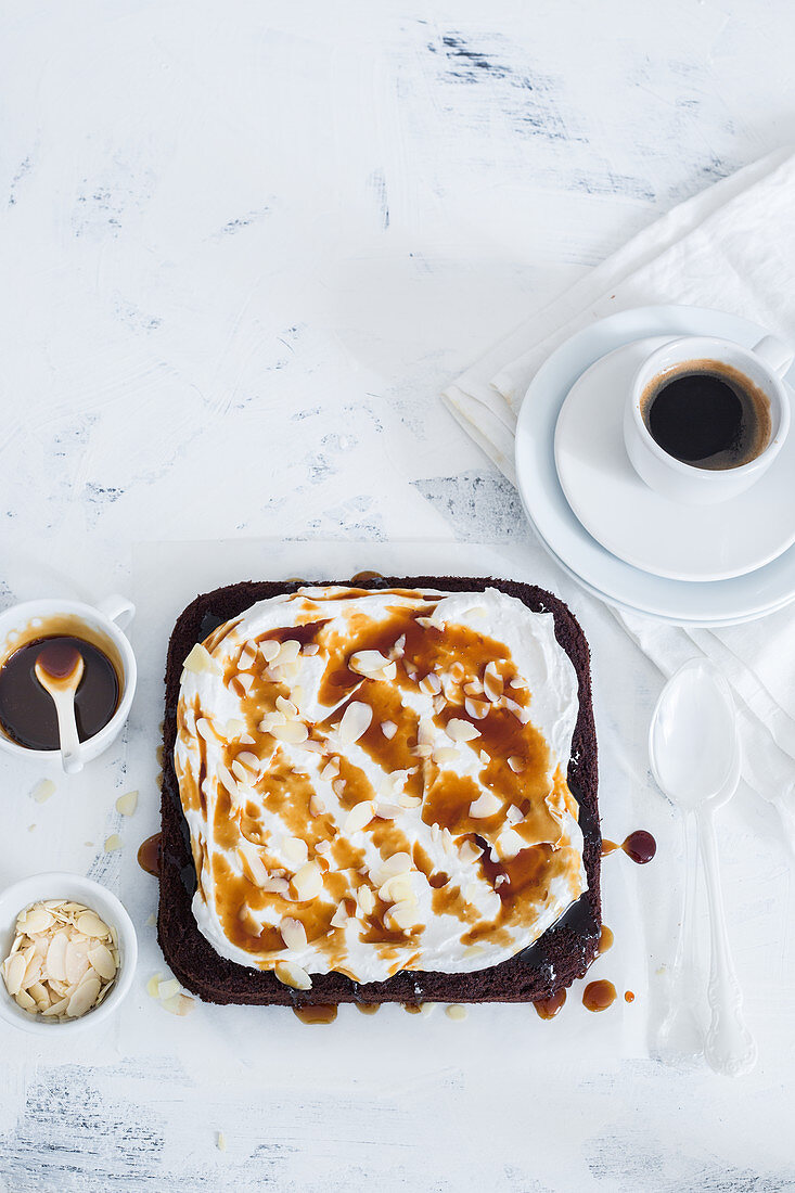 Coffee cake with whipped cream and caramel sauce