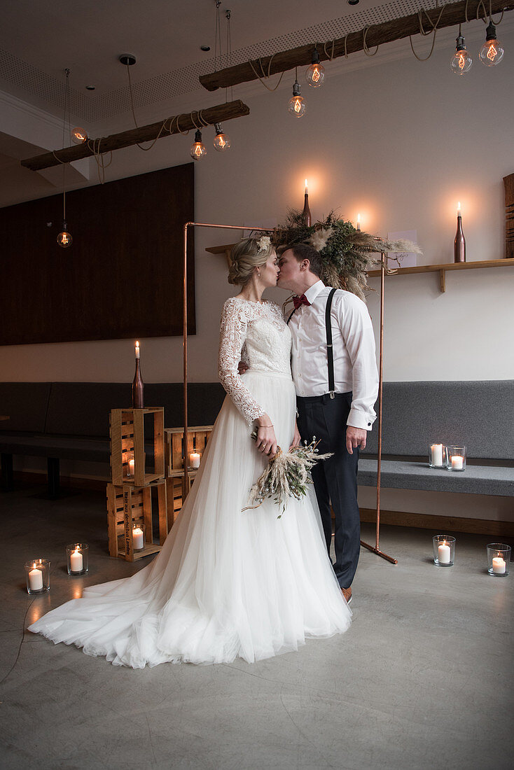 Bride and groom in vintage-style restaurant