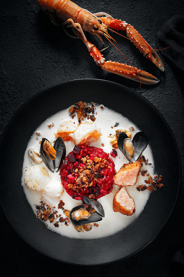 Beetroot risotto with seafood, stollen topping and ginger sauce