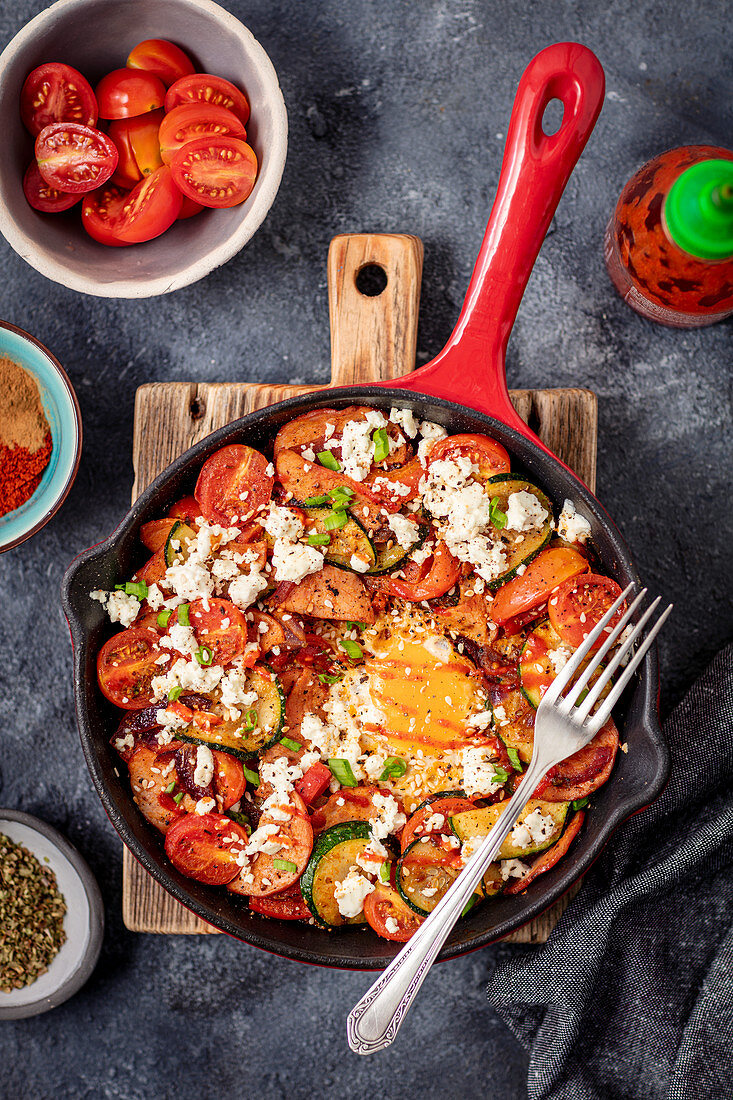 Shakshuka with sausage, courgette and cherry tomatoes