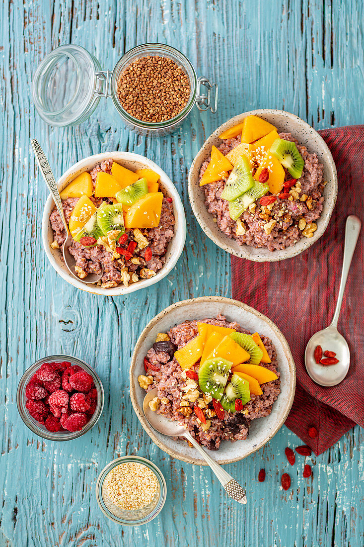 Buckwheat cooked with almond milk with raspberries, decorated with fruits