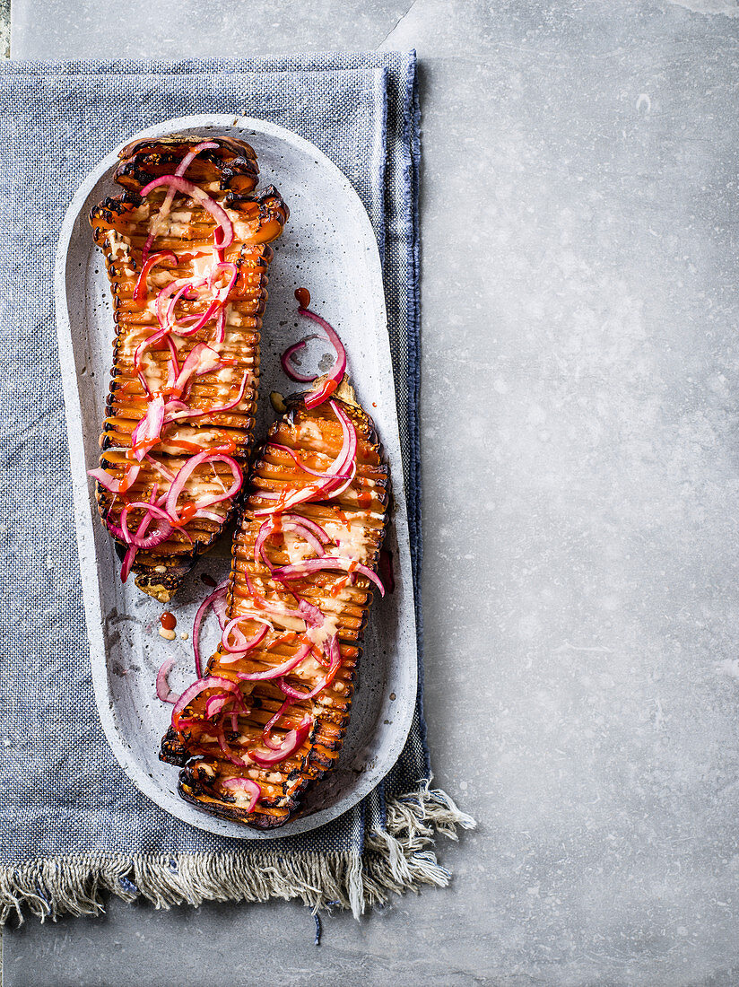 Glazed hasselback squash with sesame-honey-sriracha