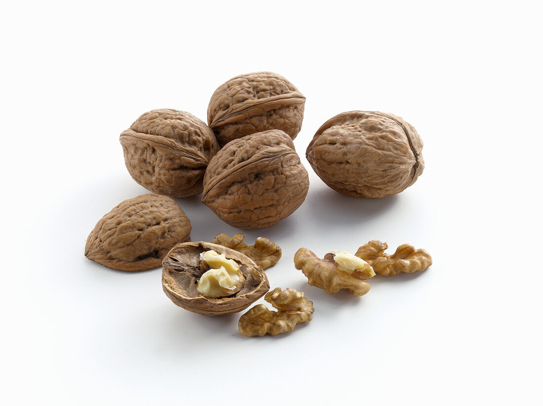 Walnuts on a white surface