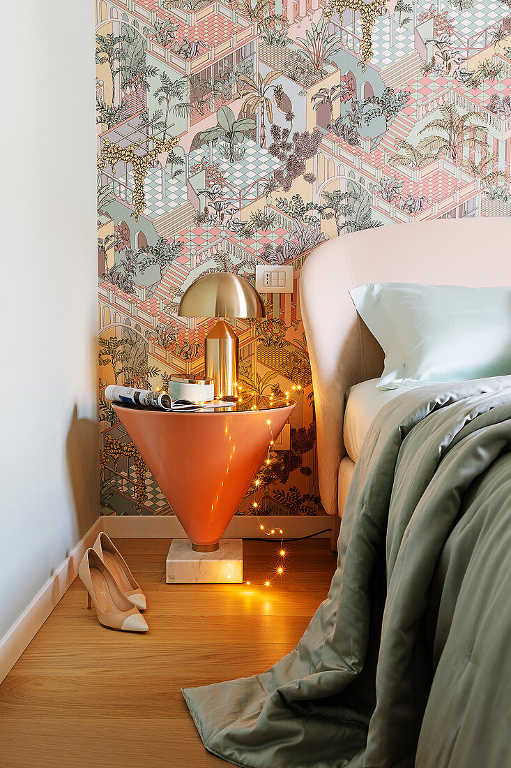 Conical bedside table and designer lamp in bedroom