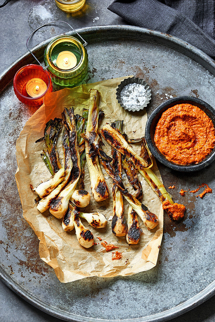 Tender spring onions with charred romesco