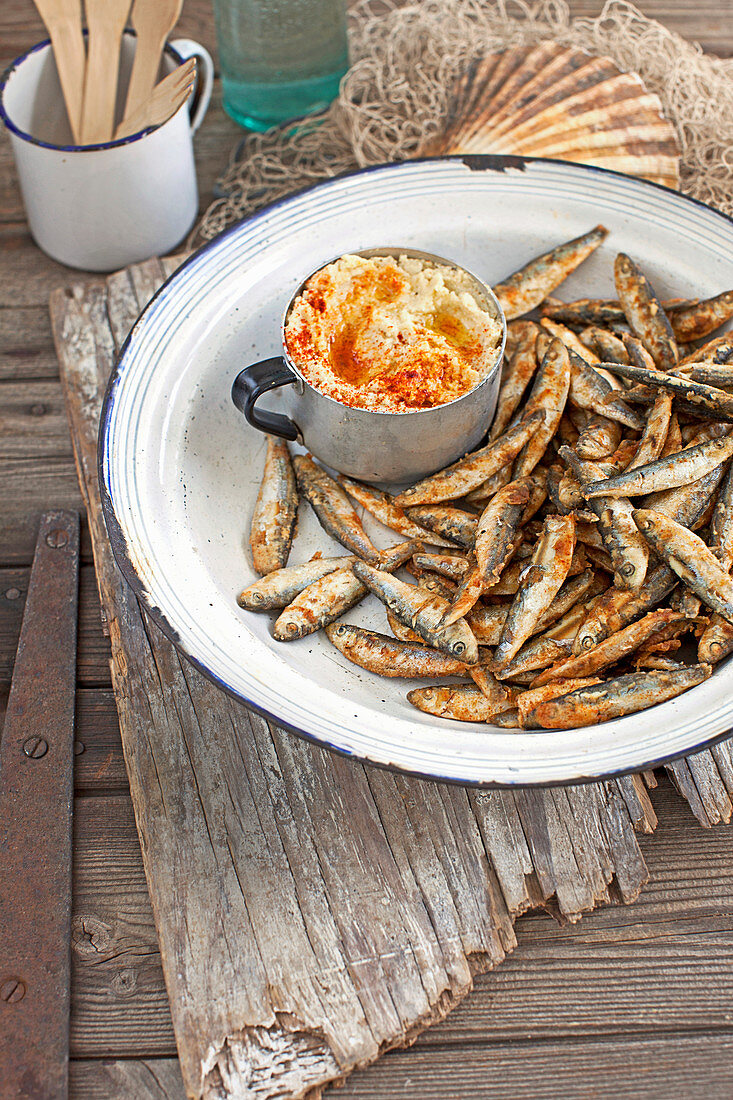 Deep fried whitebait with artichoke and white bean dip