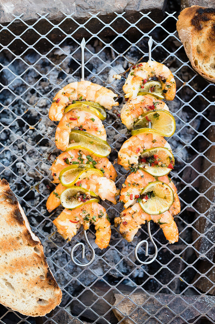 Prawn and lime kebabs on a grill