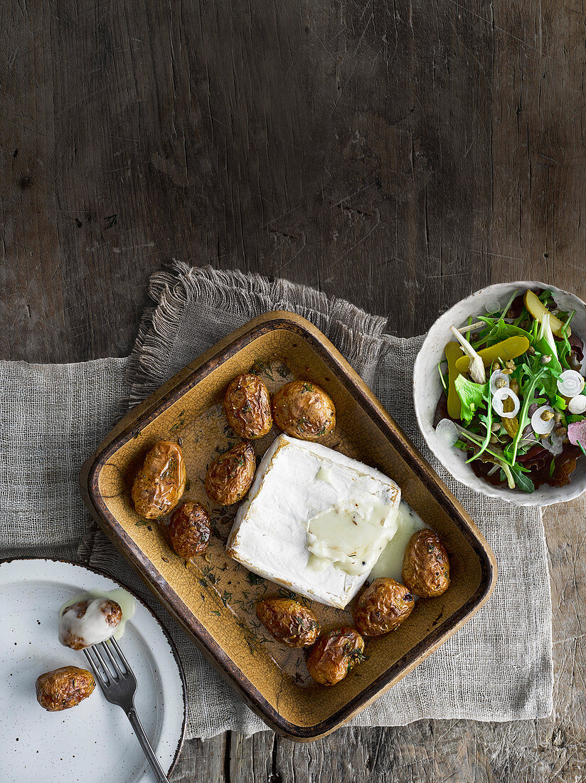 Baked Jersey Royals with brie and pickles