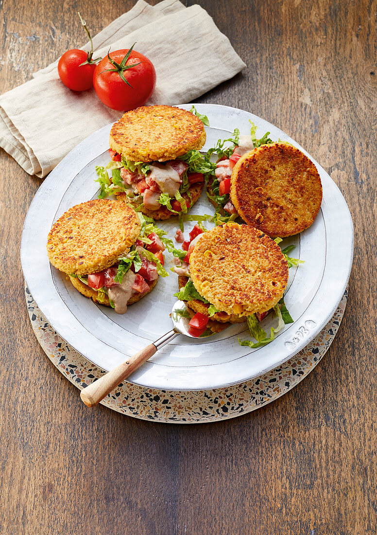 Veggie burgers with tuna and tomato salad