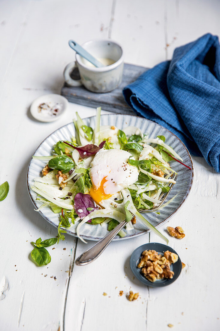 Fennel salad with poached egg and walnuts (keto cuisine)