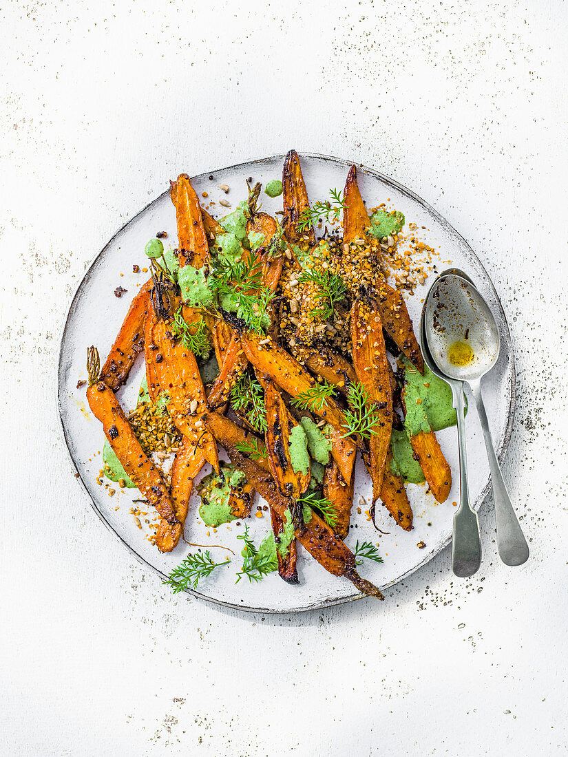 Roast carrot salad with herby carrot top yogurt