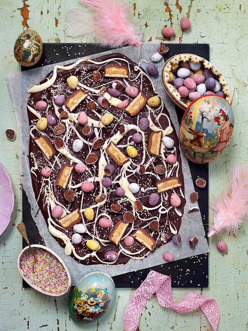 Easter chocolate brittle with chocolate eggs, pieces of chocolate and candy sprinkles
