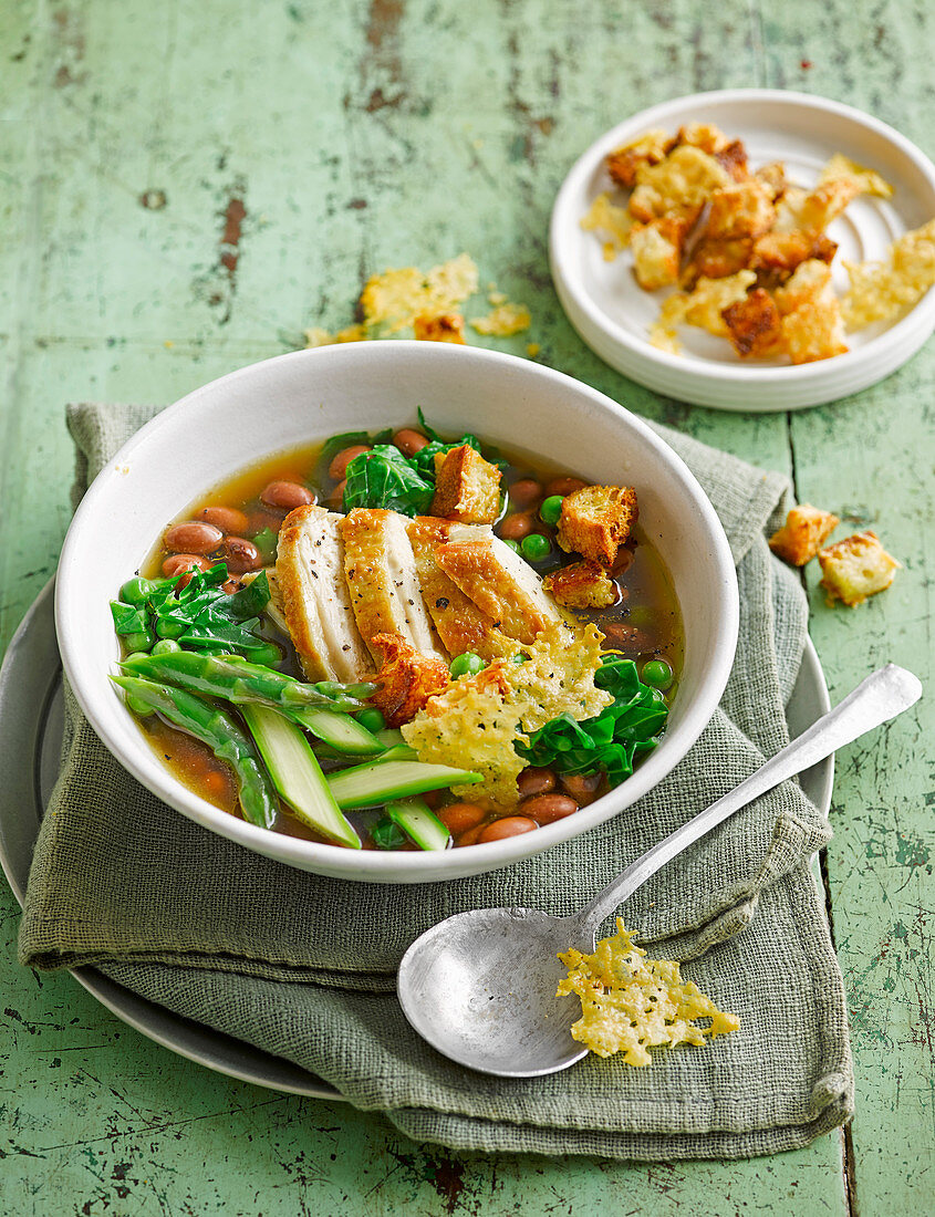Spring vegetable broth with shredded chicken