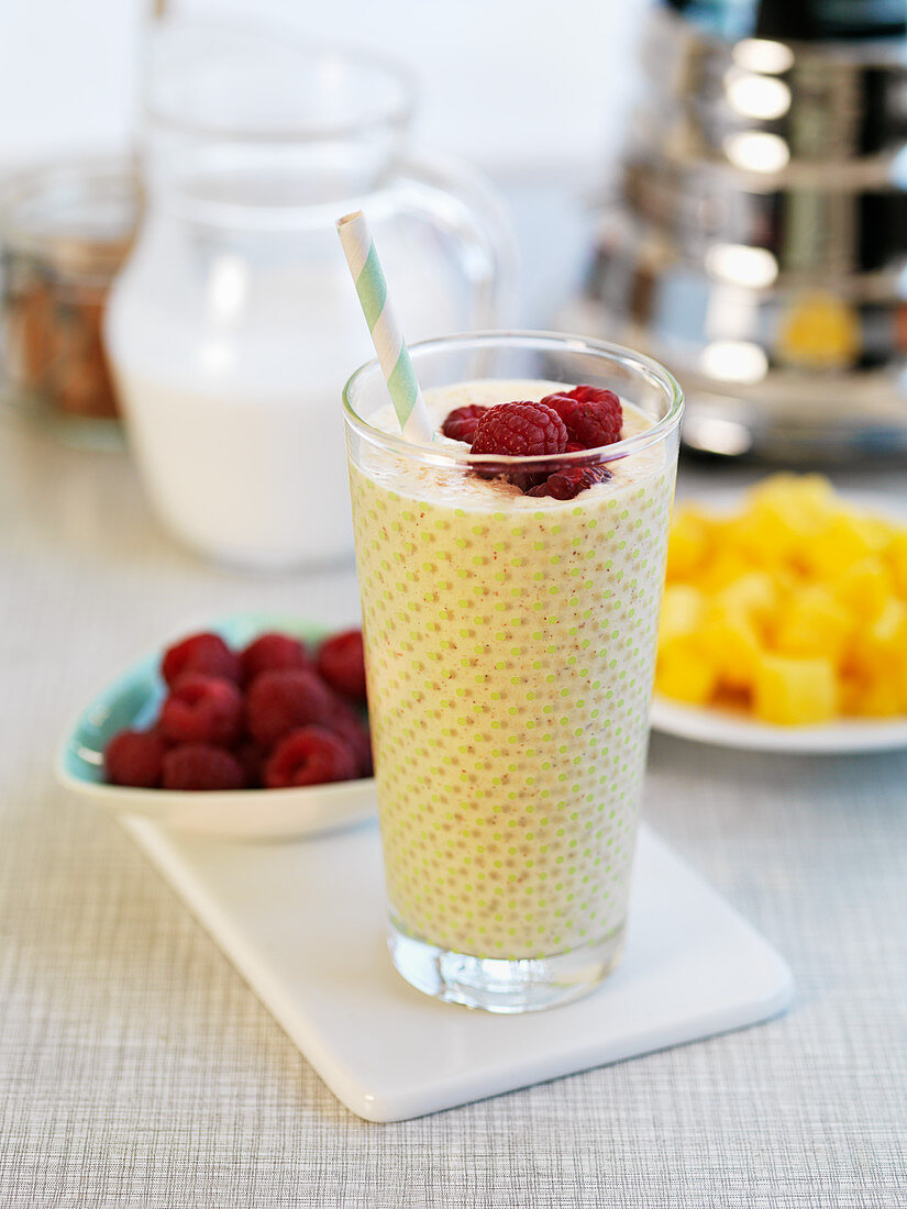 Mango smoothie with raspberries