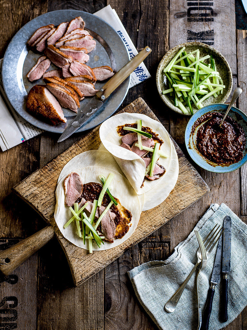 Duck with mole sauce and Peking-style pancakes