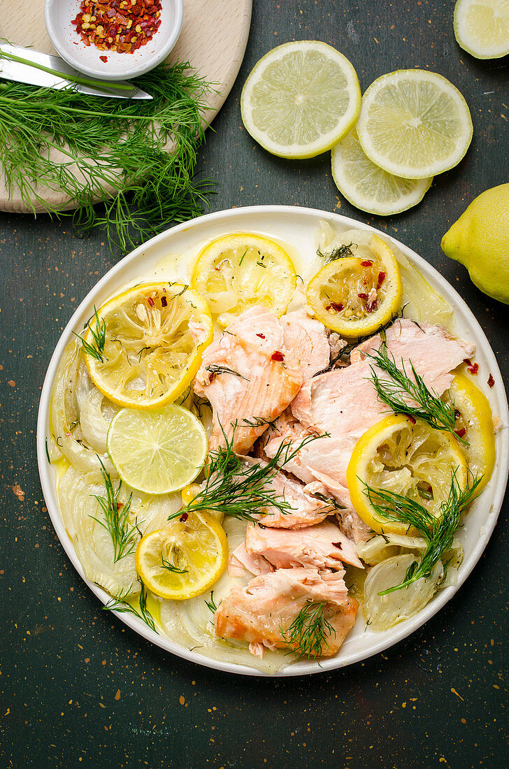 Fried salmon with fennel and lemon wedges
