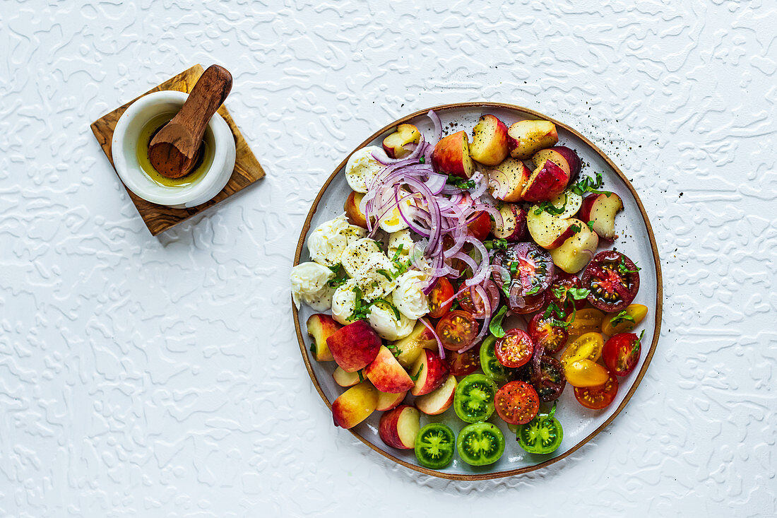 Donut peaches, tomato and mozzarella salad