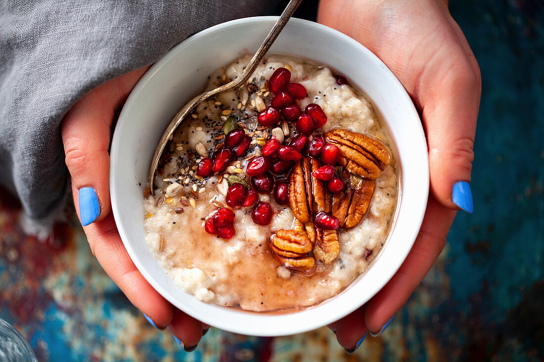 Porridge with pecan nuts and pomegranate