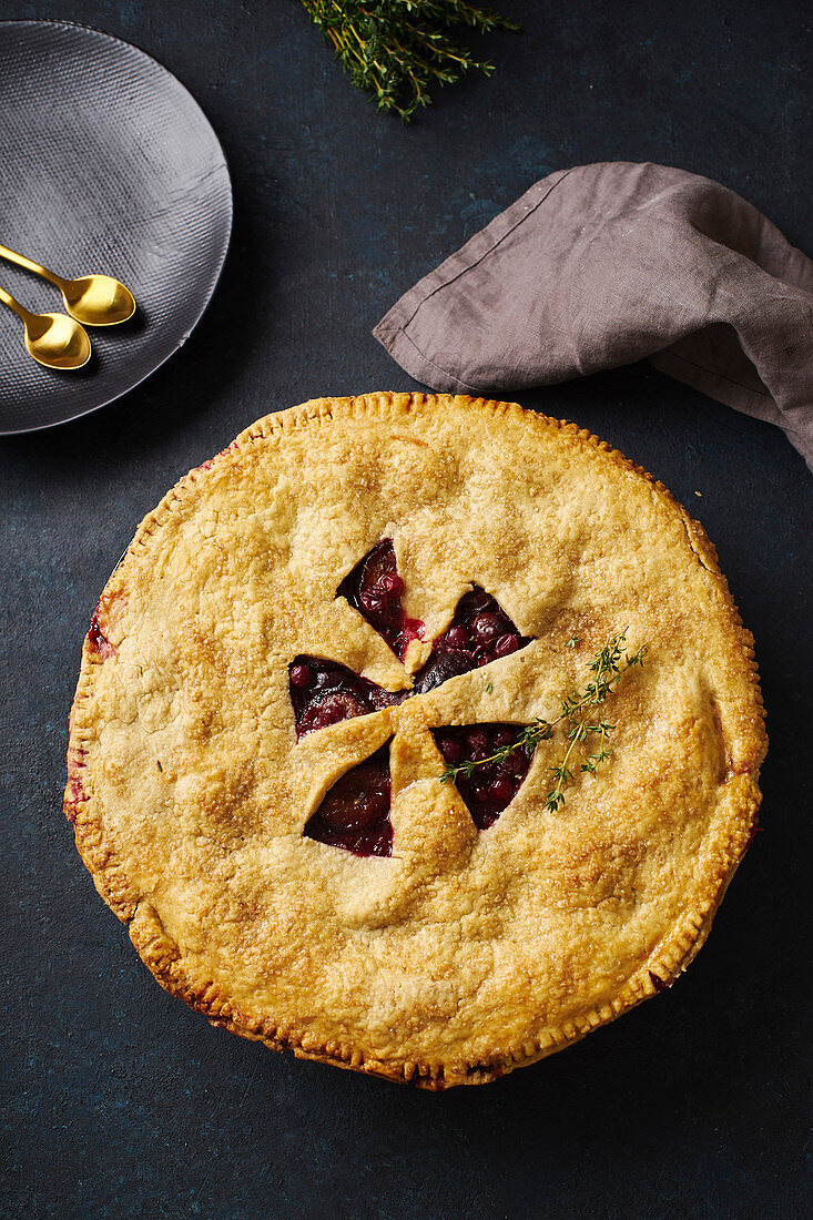Fruit pie with plums and thyme
