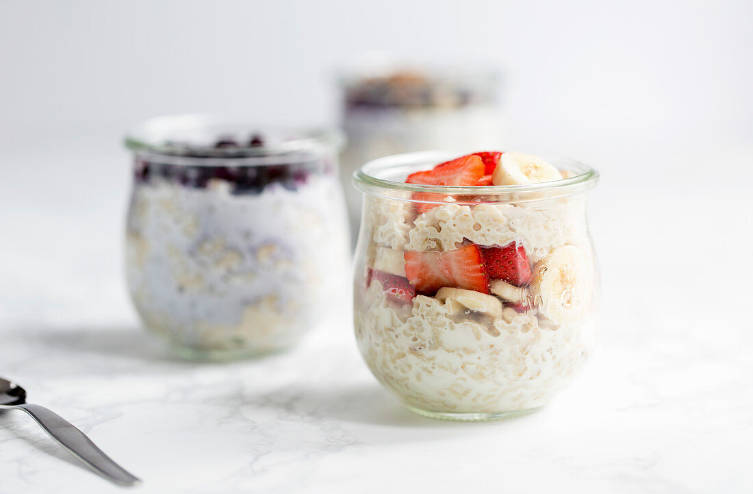 Overnight oats in glasses with different toppings