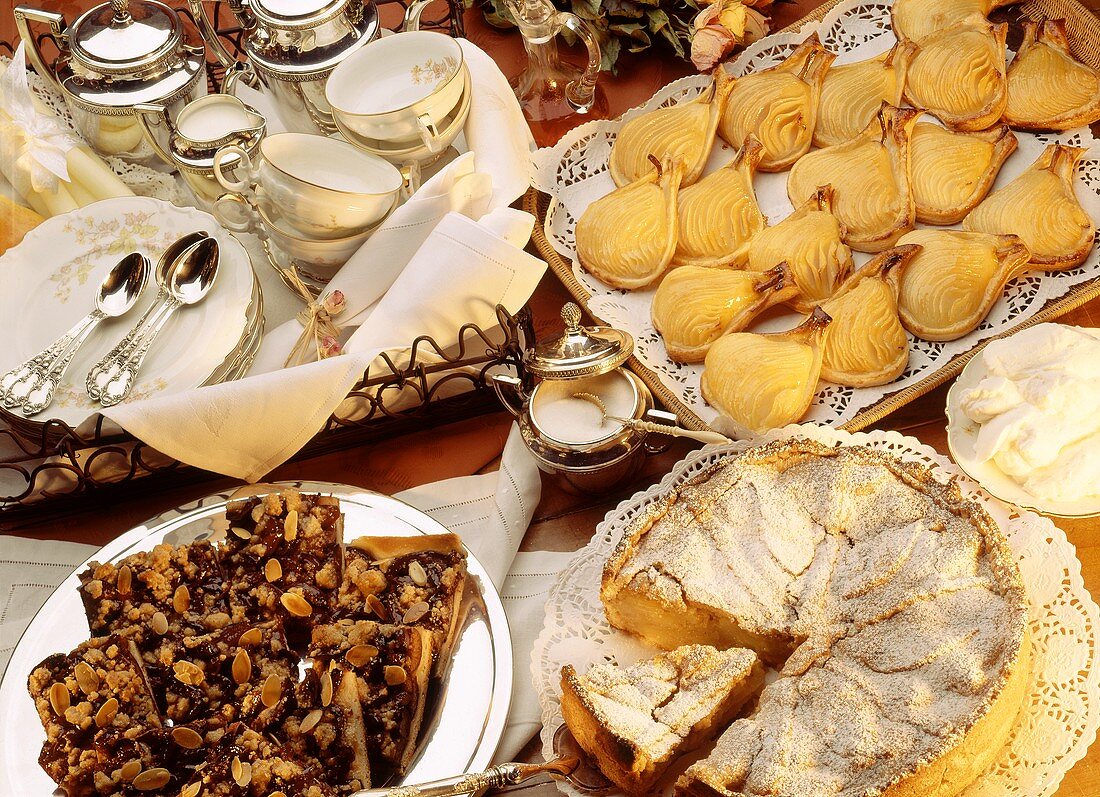 Cake buffet with plum cake, apple cake, pear slices