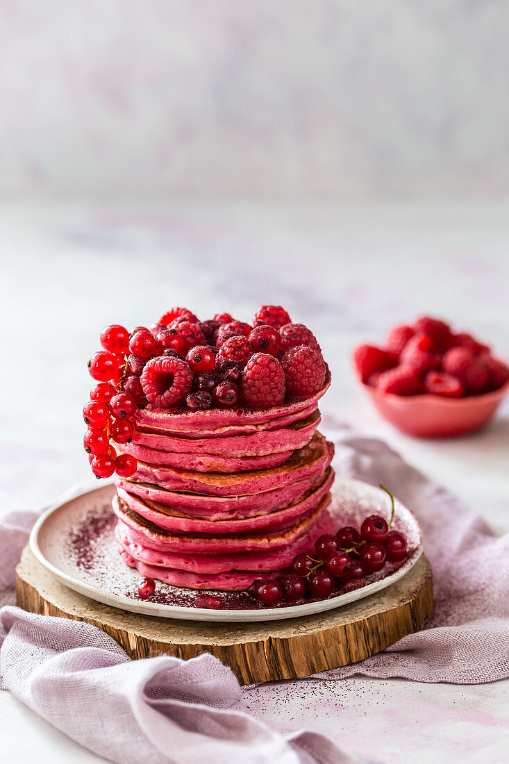 Red pancakes with berries