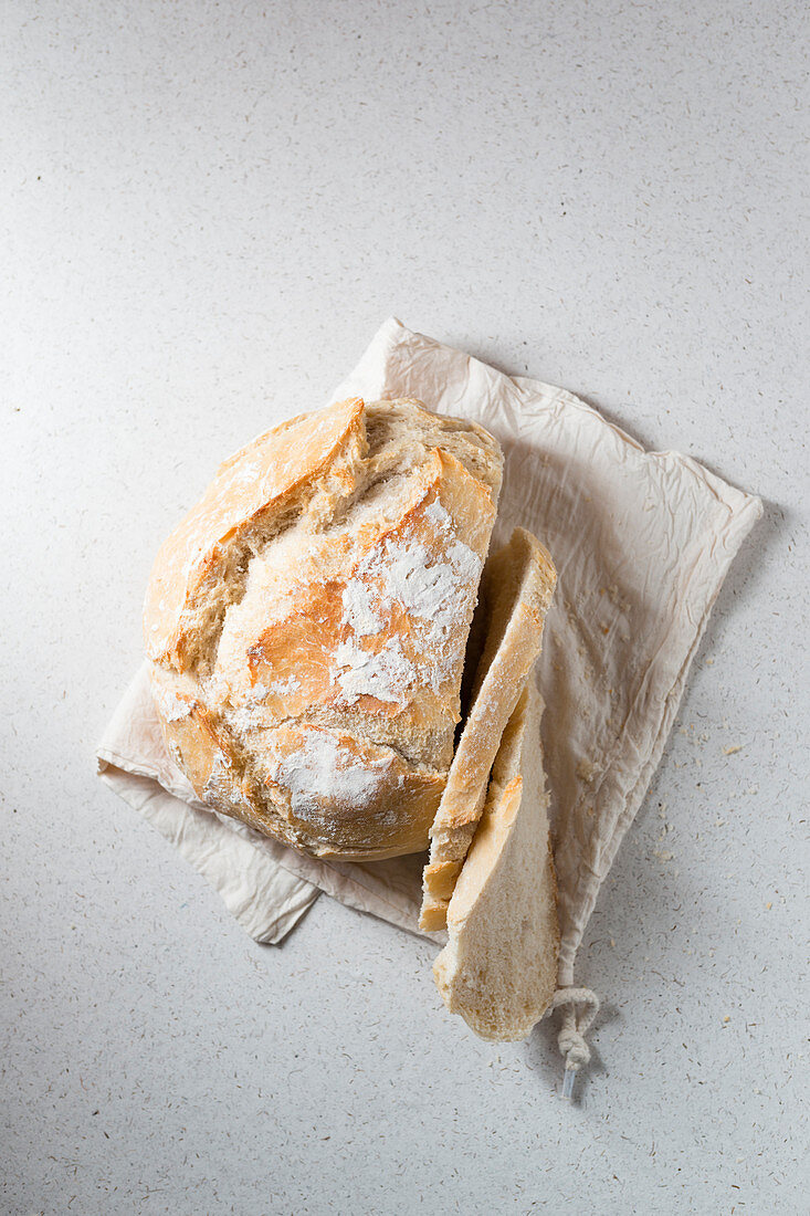 Spelt bread in a linen bag