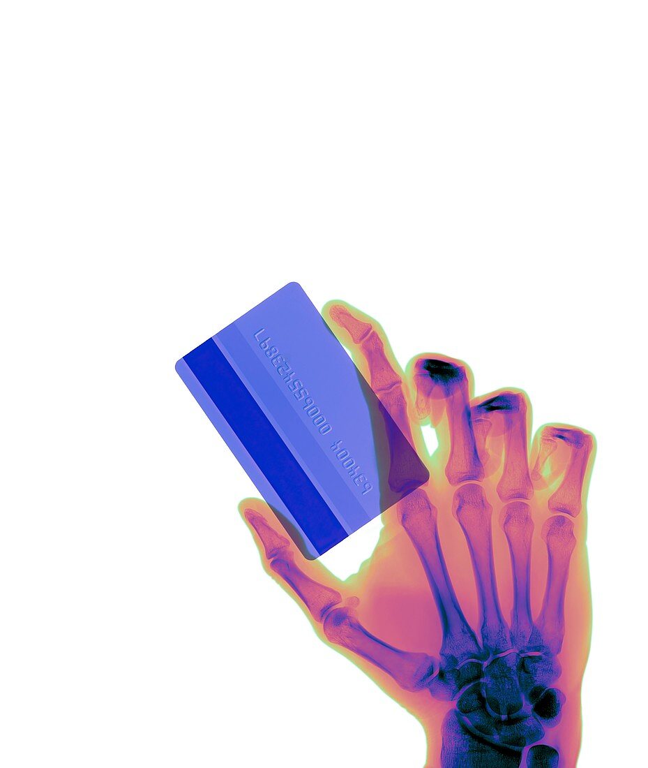 Hand holding credit card, X-ray