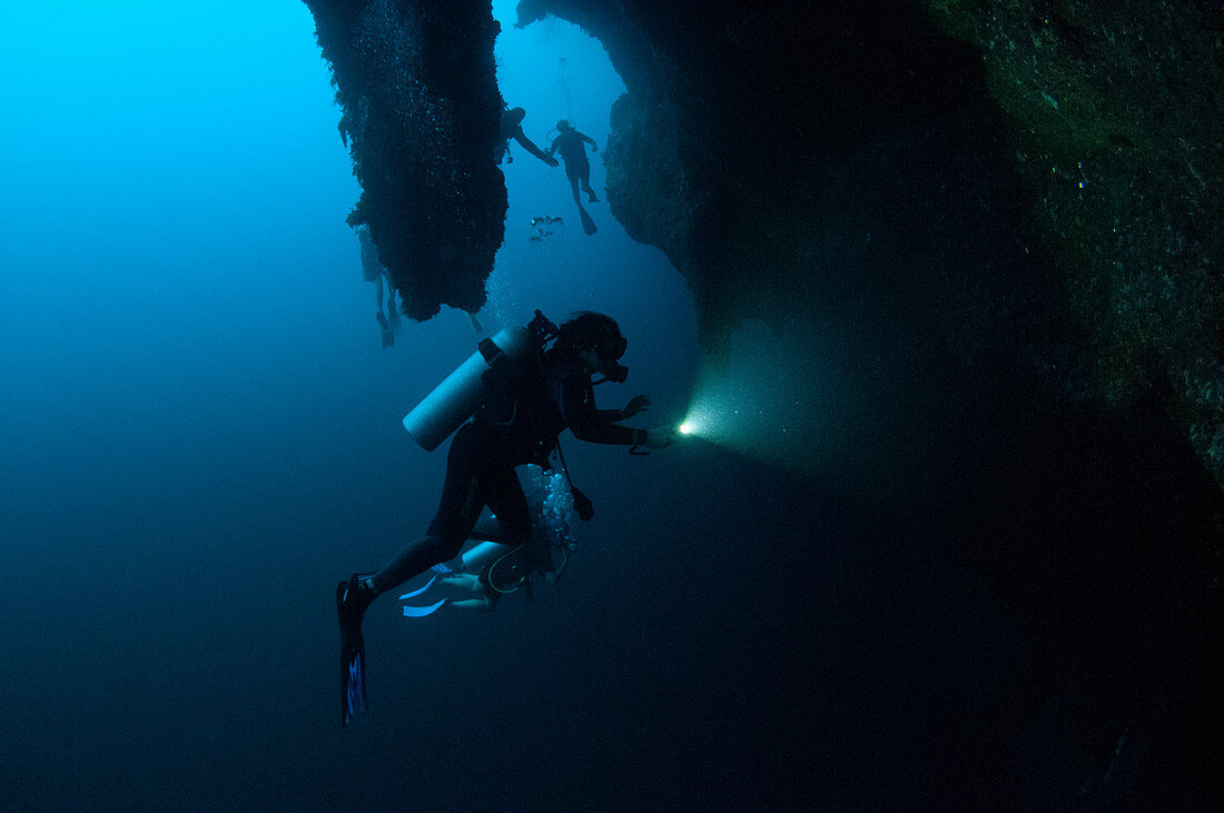 Scuba divers inside the Great Blue Hole, Belize