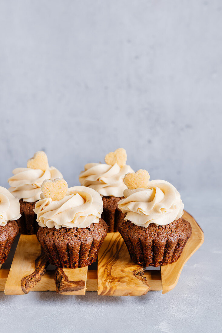 Chocolate peanut butter cupcakes decorated with heart shaped mini cookies