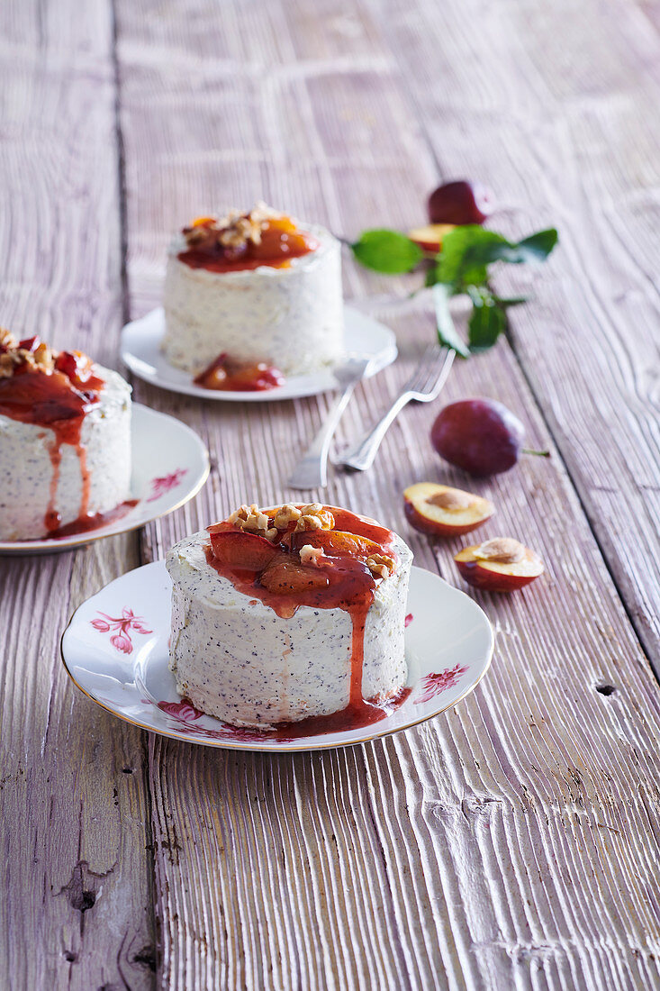 Poppy seed cheesecakes with plum sauce