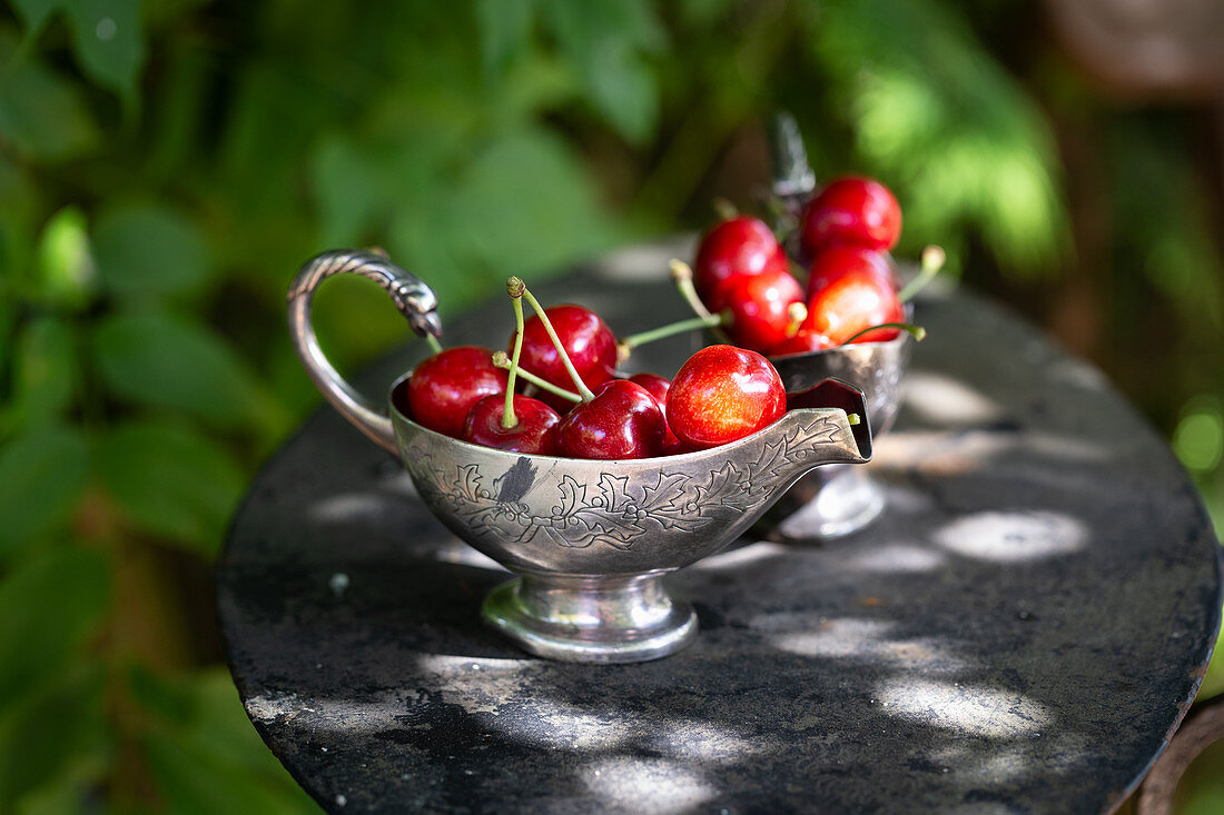 Fresh cherries in a gravy boat