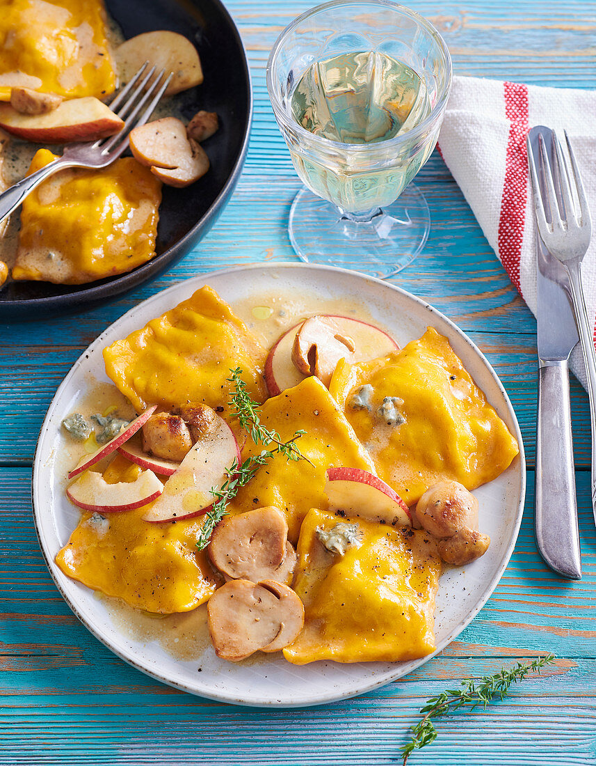 Pumpkin ravioli with apples and porcini mushrooms