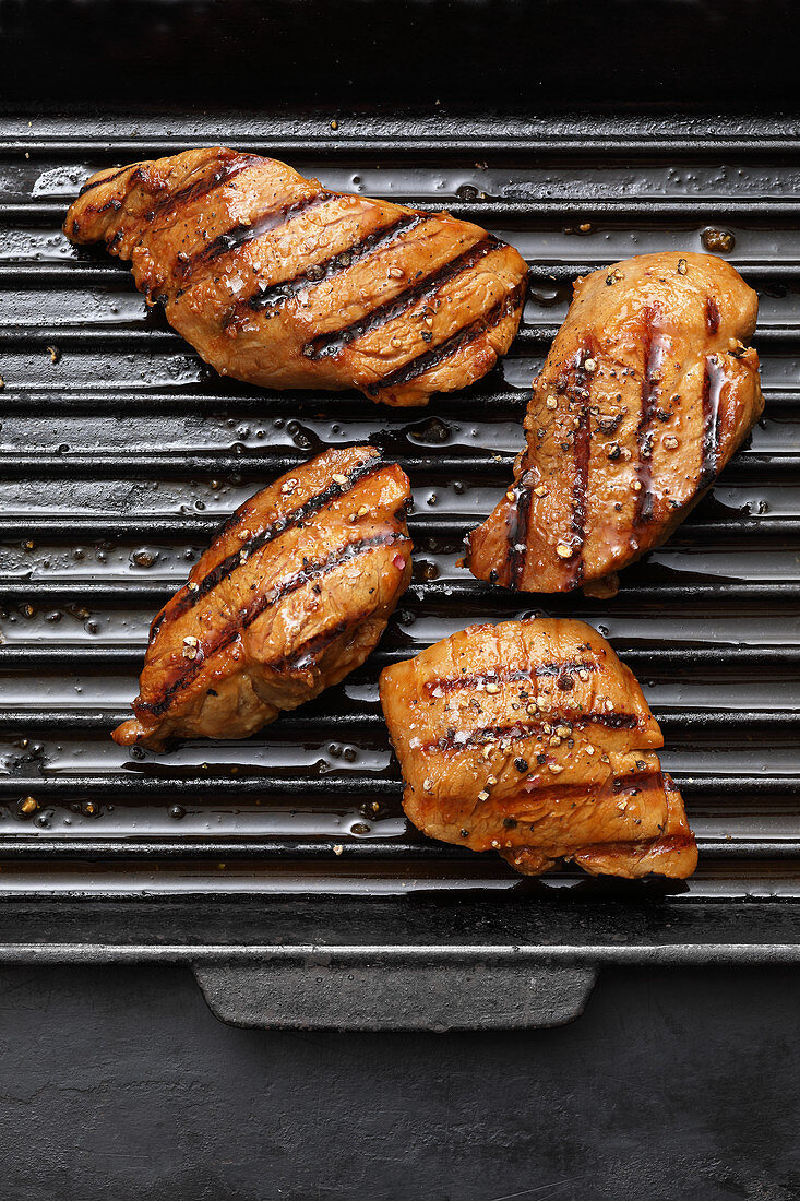 Grilled glazed pork fillet medallions