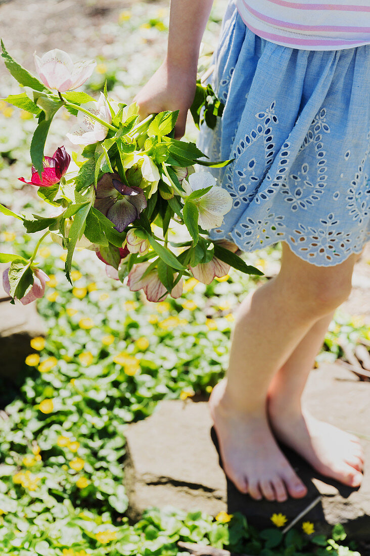 Girl holding bouquet of flowers