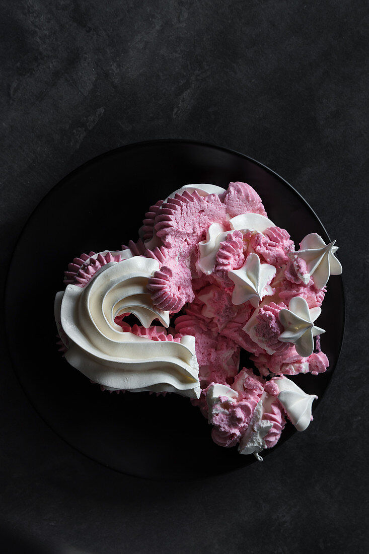 Crushed heart-shaped meringue cake
