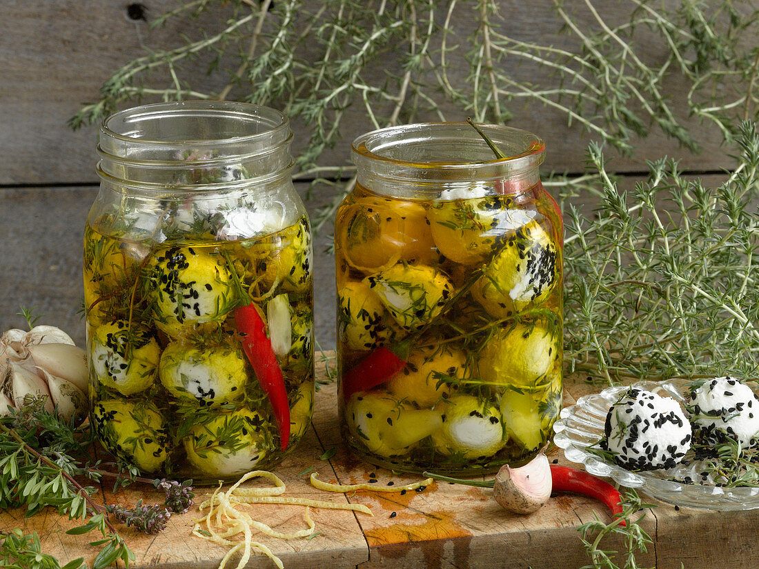 Goat's cheese preserved in olive oil with herbs and chilli